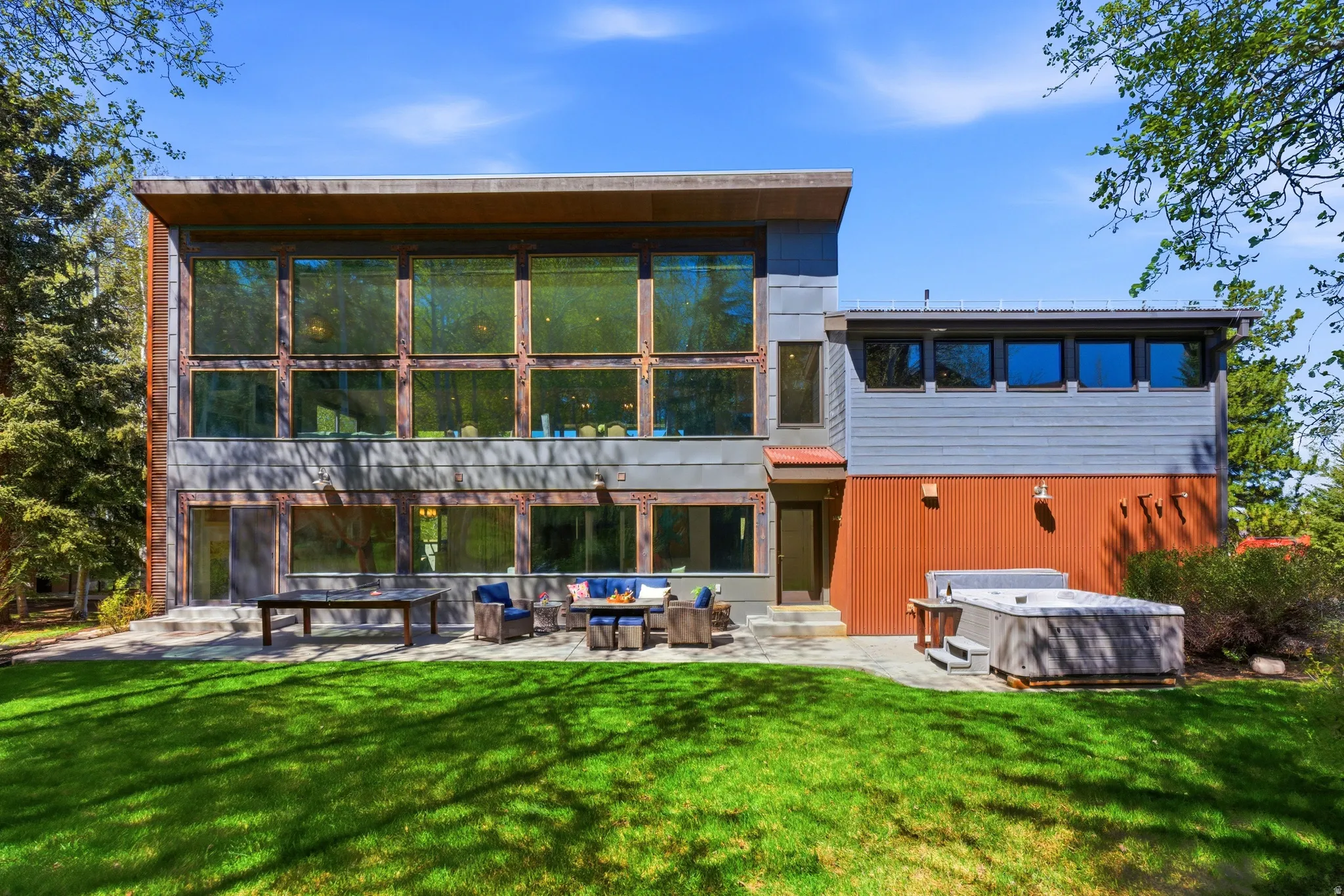 Contemporary exterior with expansive windows and a flat roofline