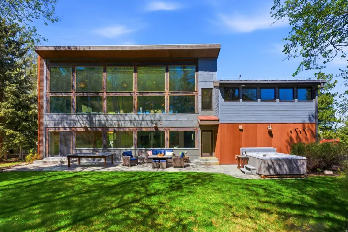 Contemporary exterior with expansive windows and a flat roofline