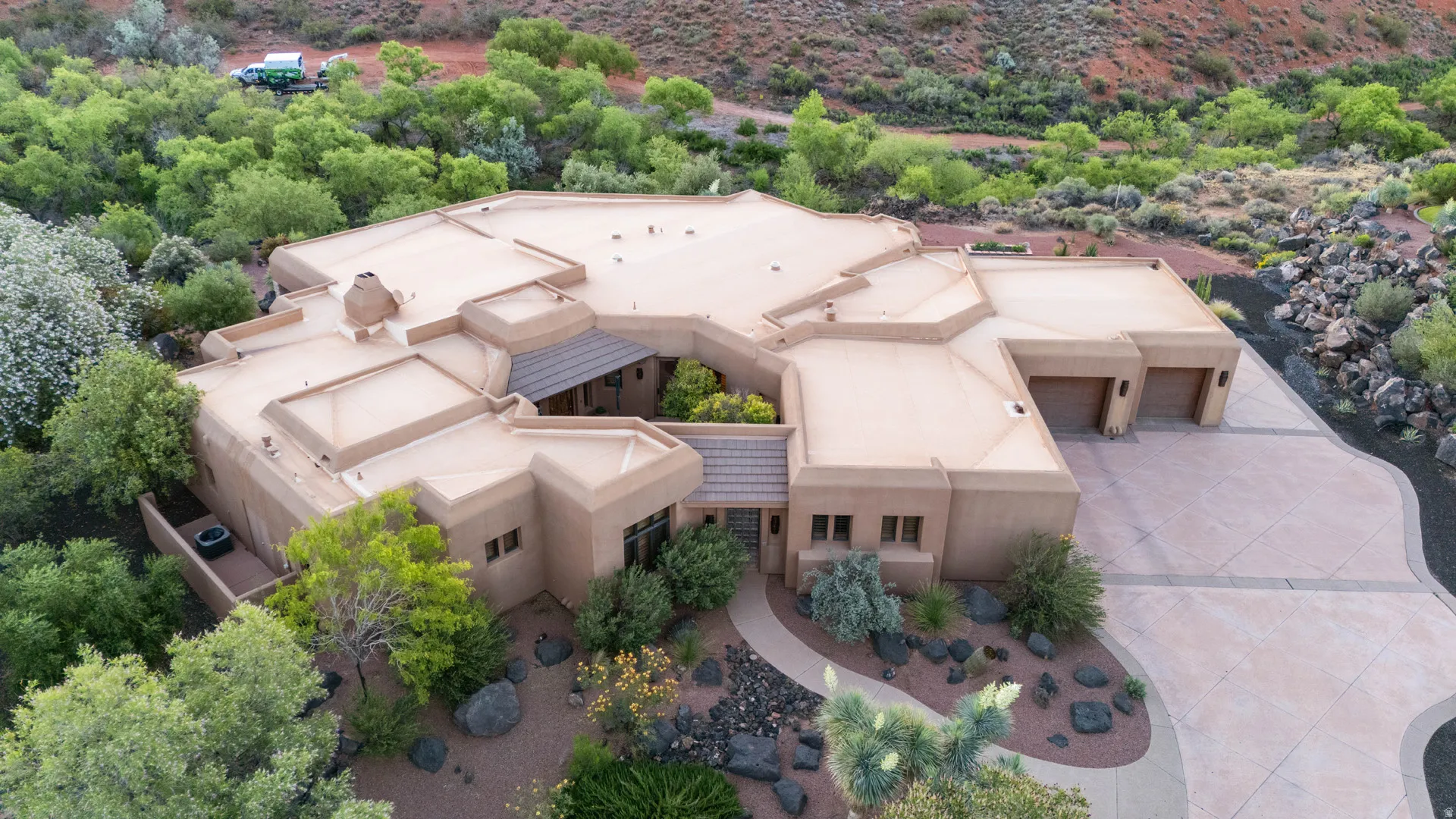 Southwestern-style residence featuring a stucco exterior and a flat roofline