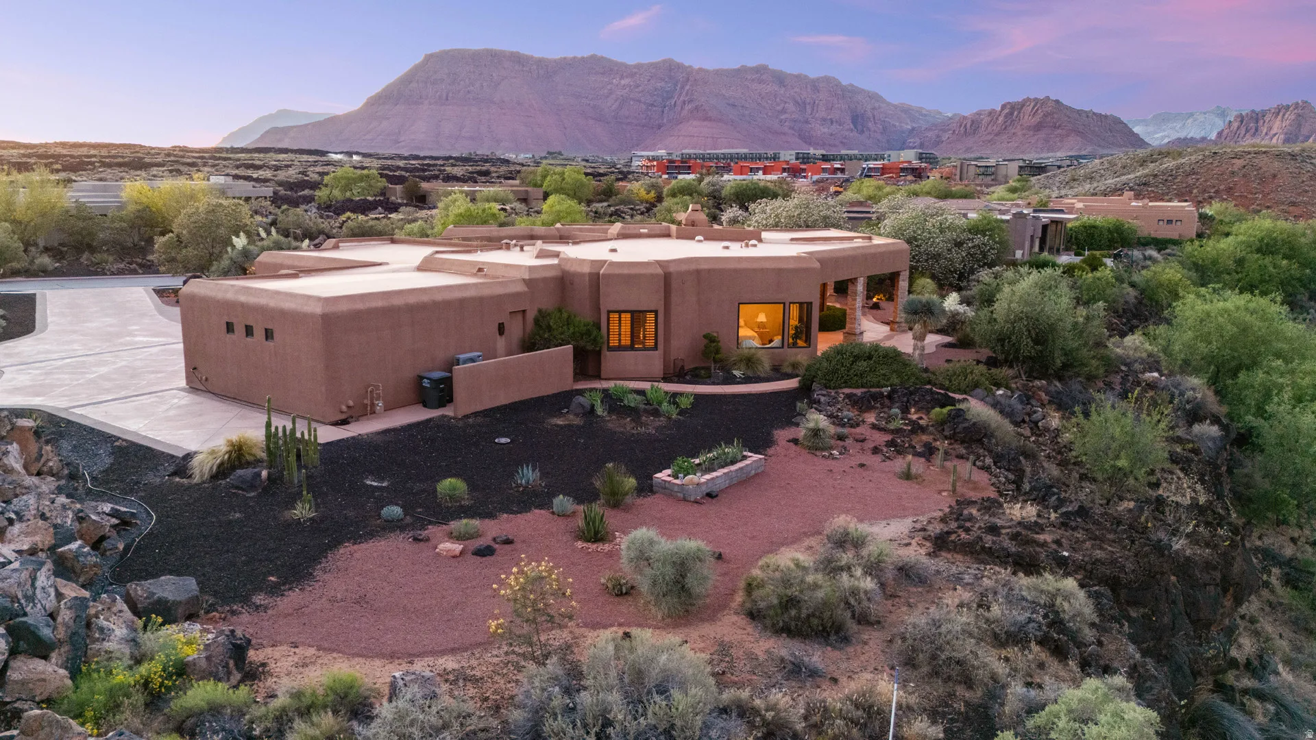 Southwestern-style residence featuring a stucco exterior and multiple rooflines