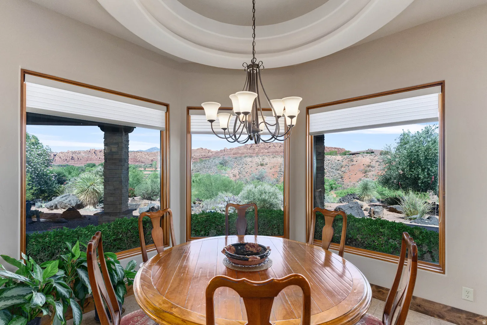 Bay window with wood trim, offering desert landscape views