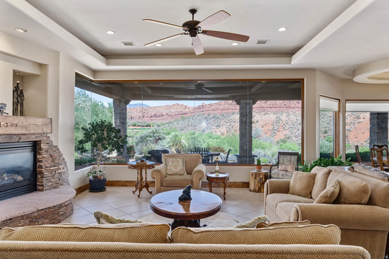 Living area with expansive windows showcasing a desert landscape