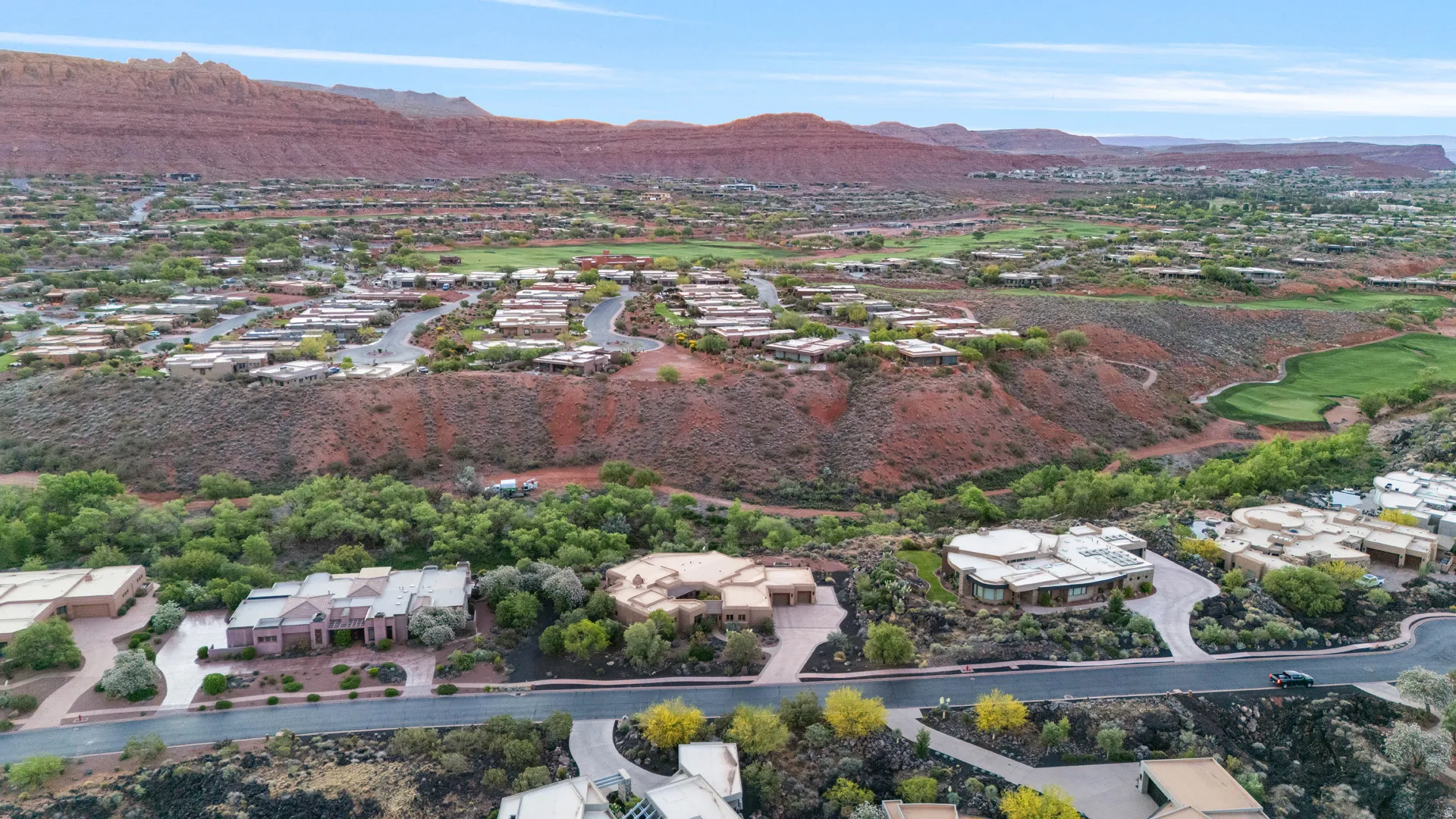 Expansive residential area featuring contemporary architecture and red rock mountain backdrop