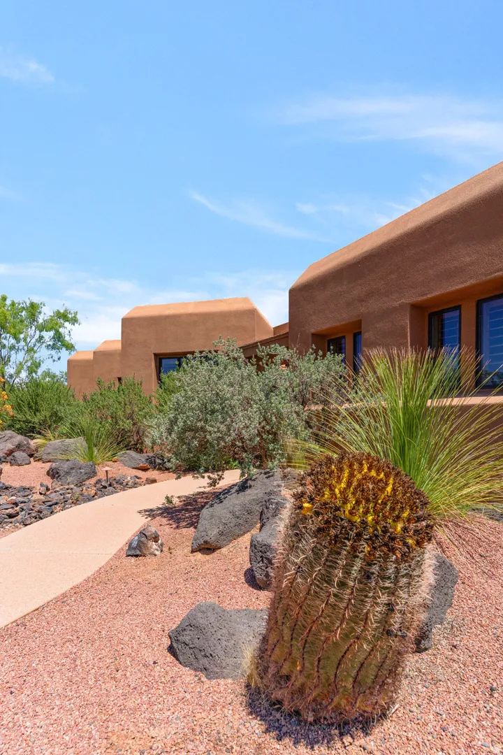 Southwestern-style architecture featuring a stucco exterior and horizontal windows