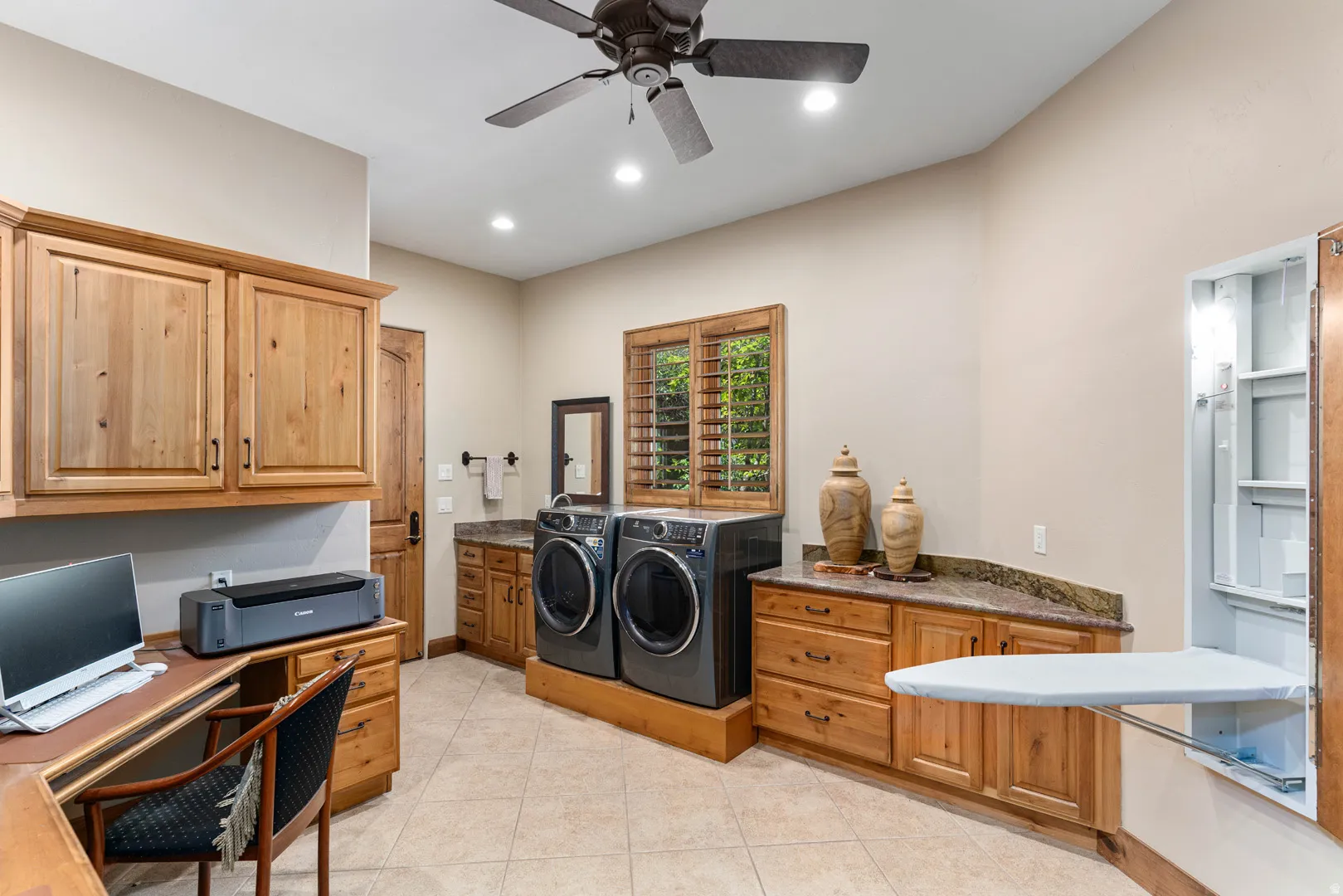 Dedicated utility room with integrated laundry appliances