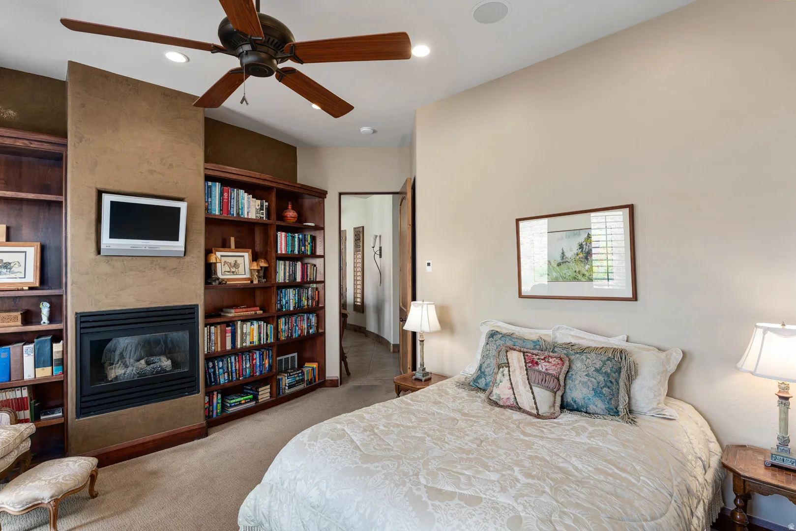 Built-in fireplace with a mounted television above