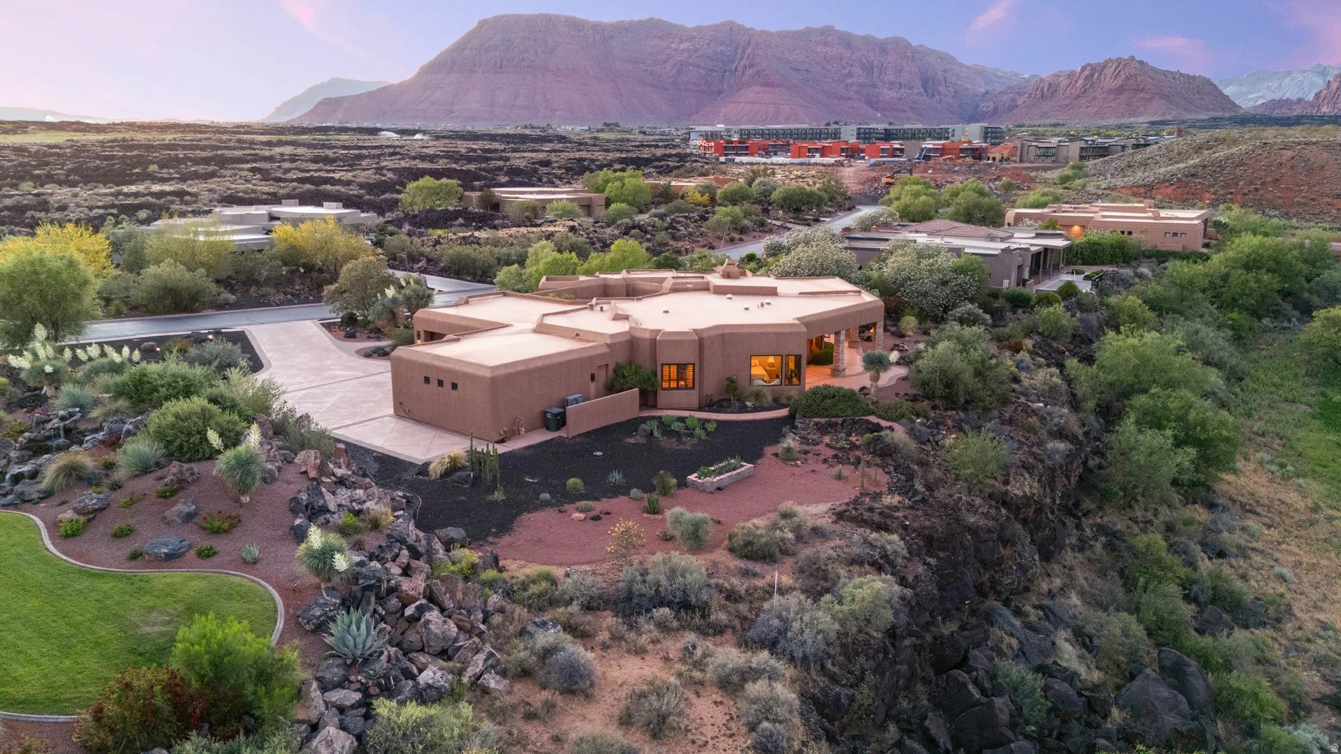 Southwestern-style residence featuring a stucco exterior and a flat roofline