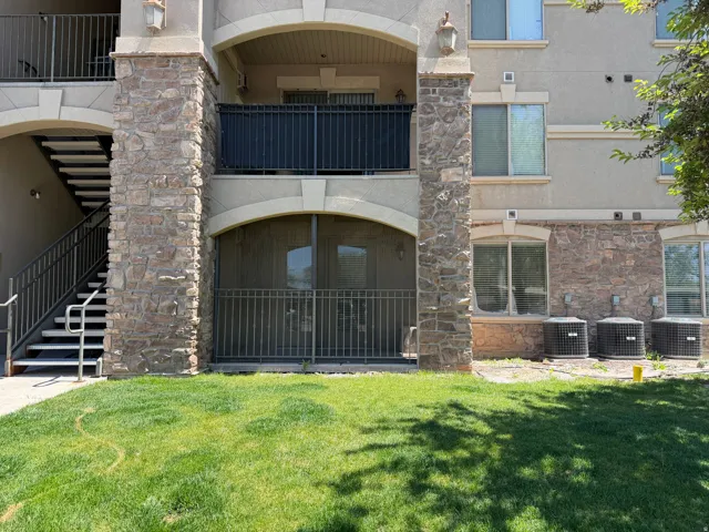 Exterior featuring a stone facade and stucco finish