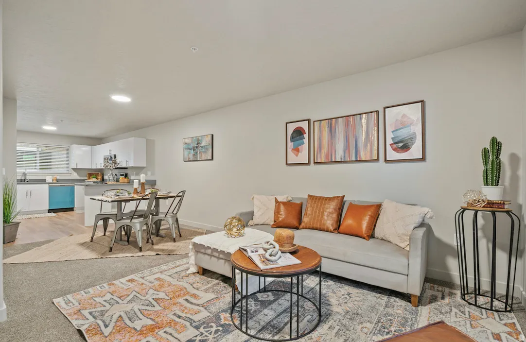 Open-concept living space featuring a combined living room, dining area, and kitchen