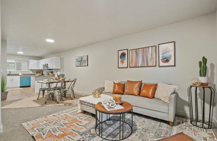 Open-concept living space featuring a combined living room, dining area, and kitchen