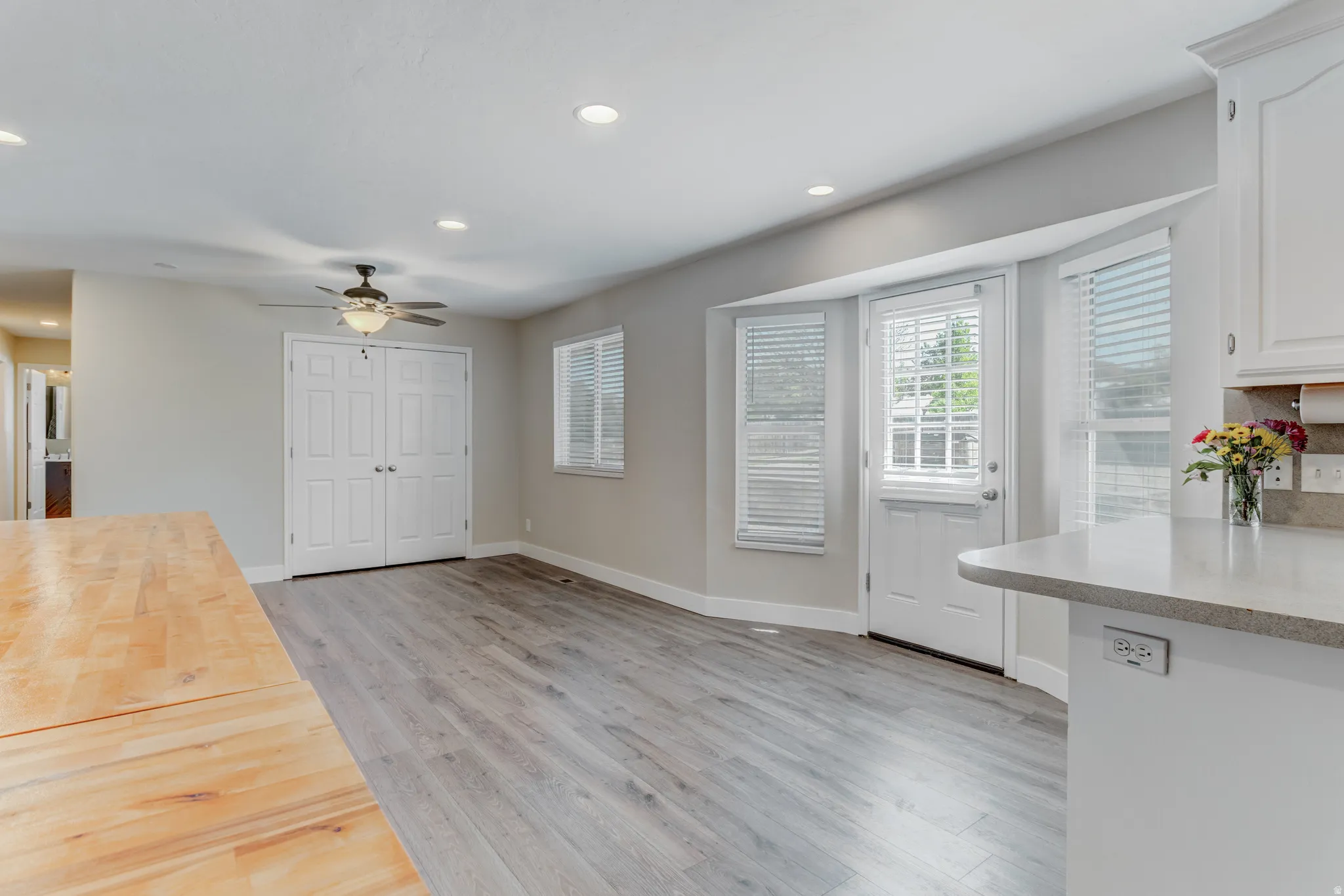 Open concept living area with wood-finish flooring