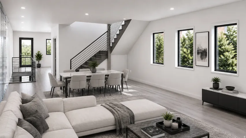 Open-concept living area featuring light wood-finish flooring, a modern black metal staircase railing, and multiple large windows with black frames