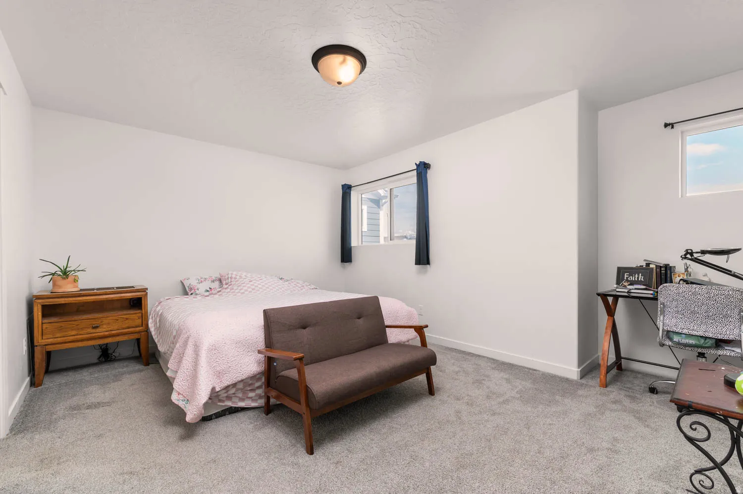 Bedroom featuring light gray carpet flooring and white painted walls