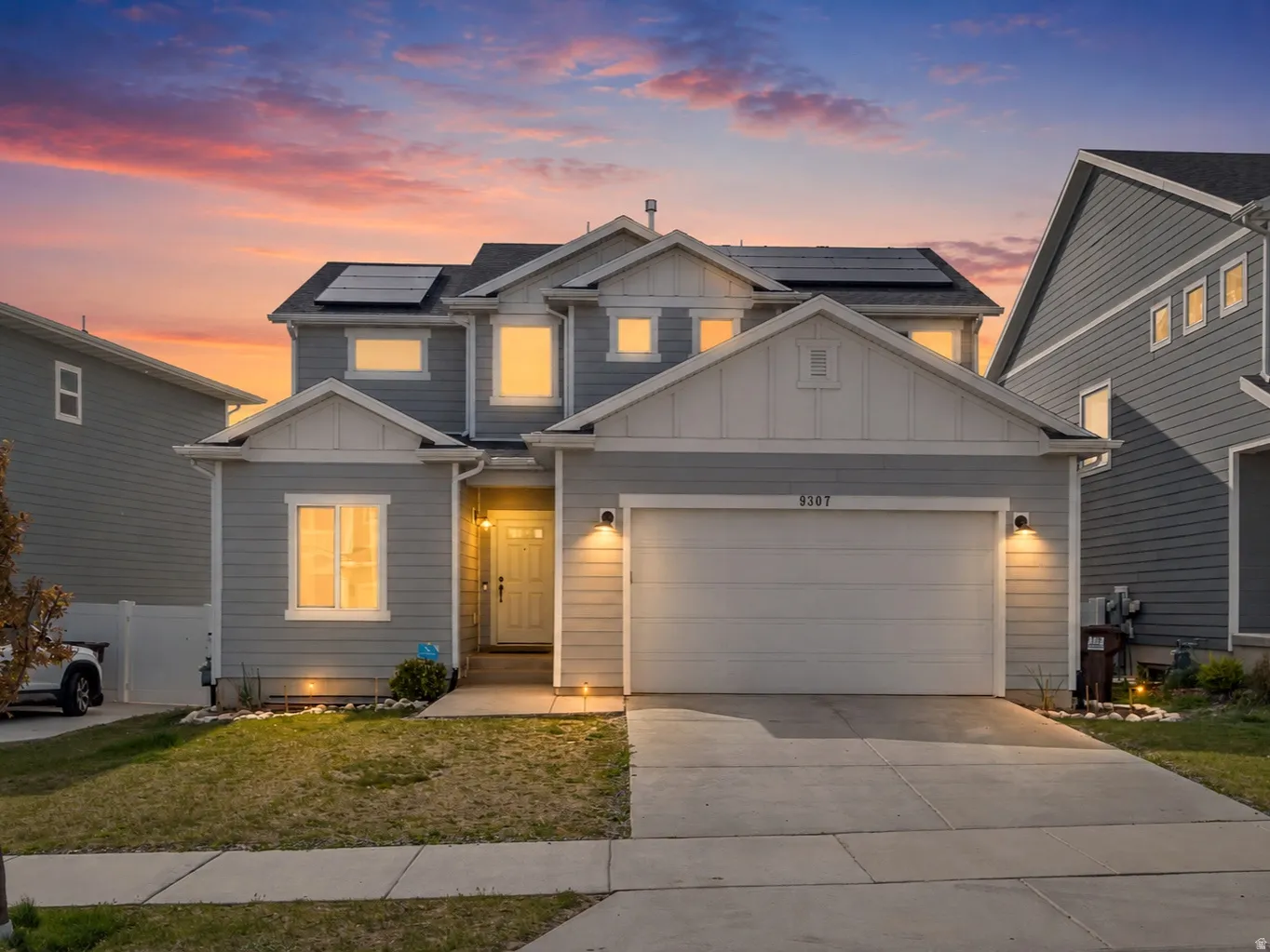Twilight photo of home with West Sunset behind.