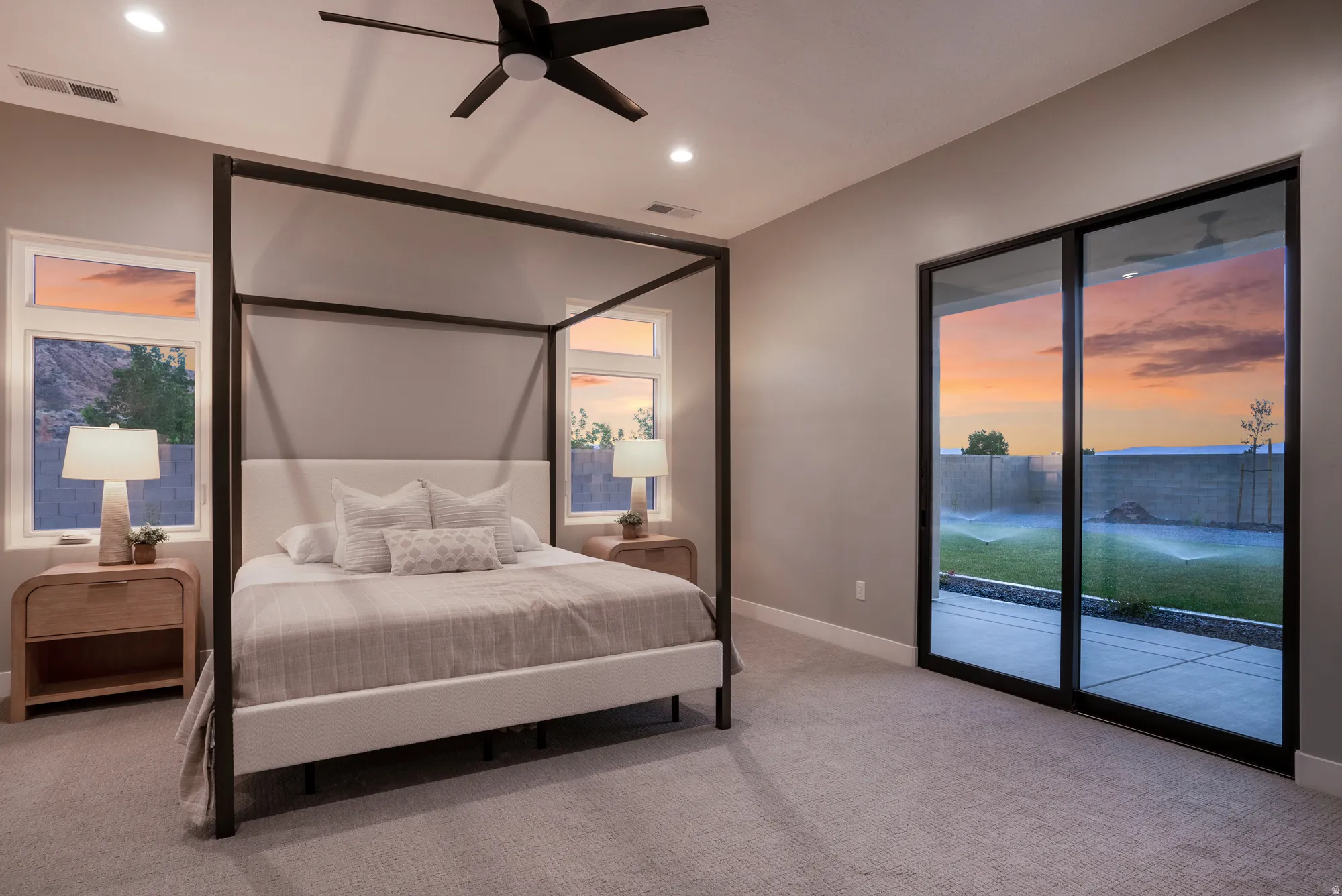 Room featuring a black ceiling fan, recessed lighting, and light gray carpeting