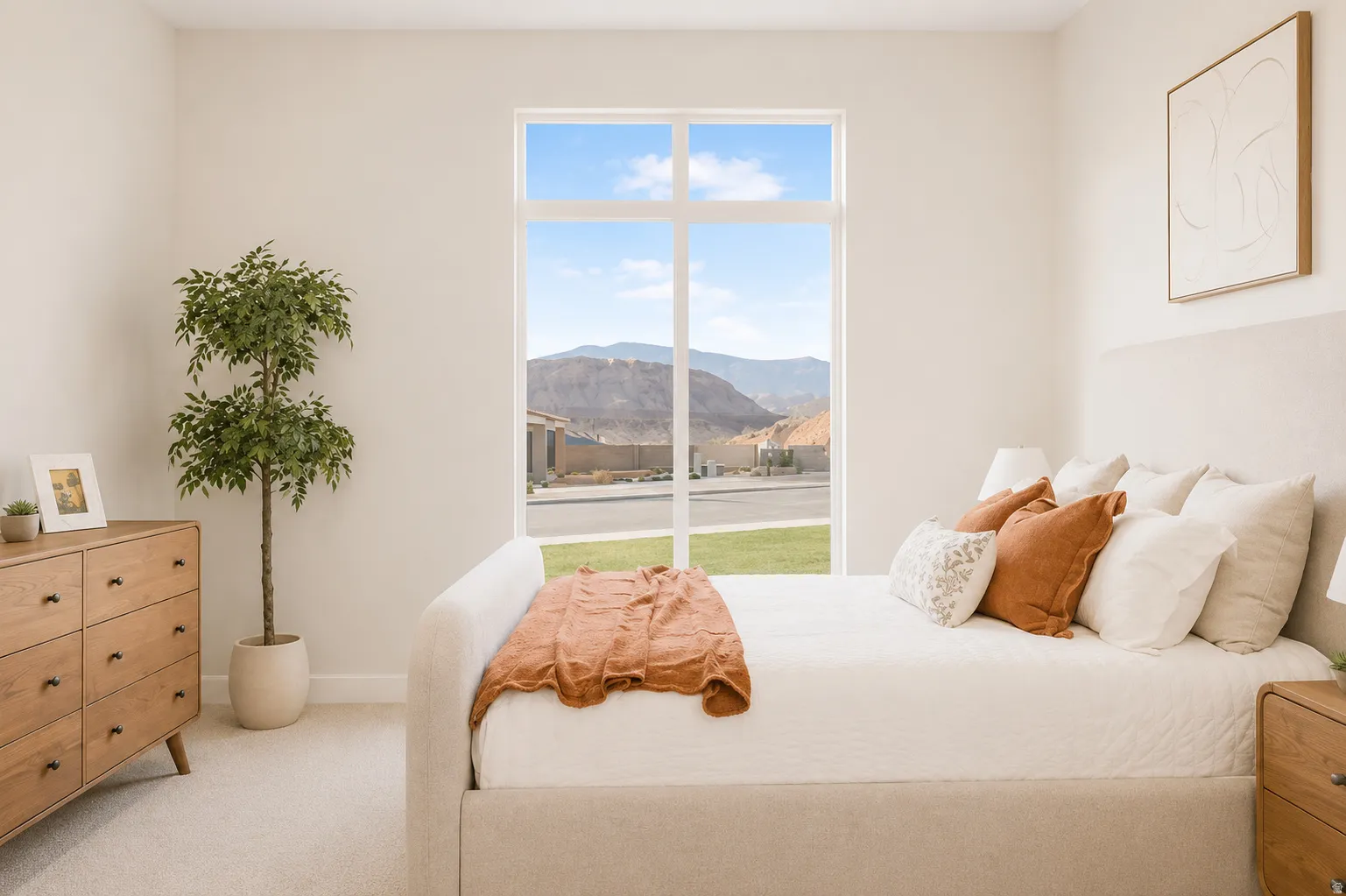 Bright bedroom featuring a large window, plush carpet flooring, and neutral wall tones