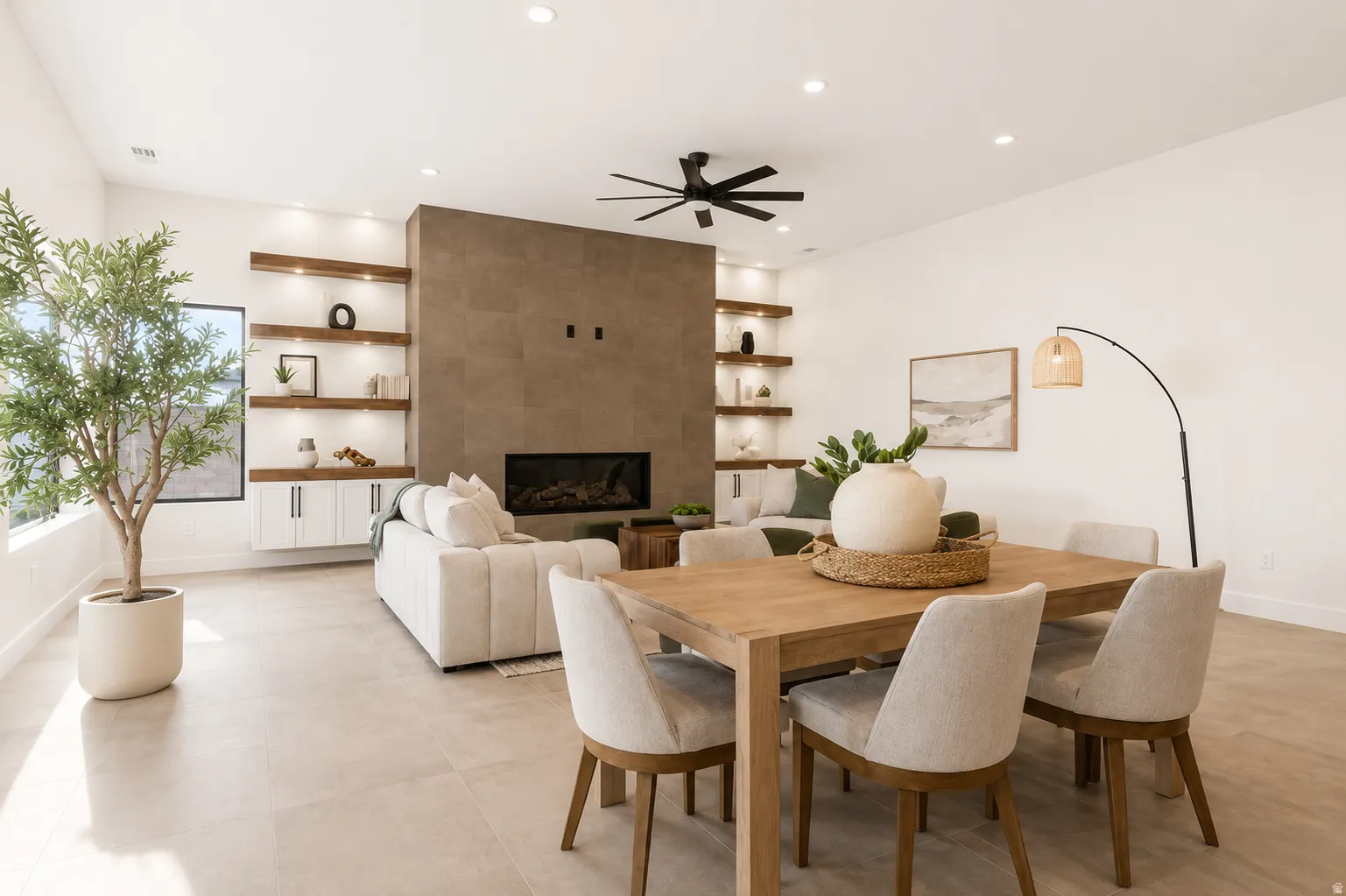 Open-concept living space featuring light-toned flooring and recessed lighting