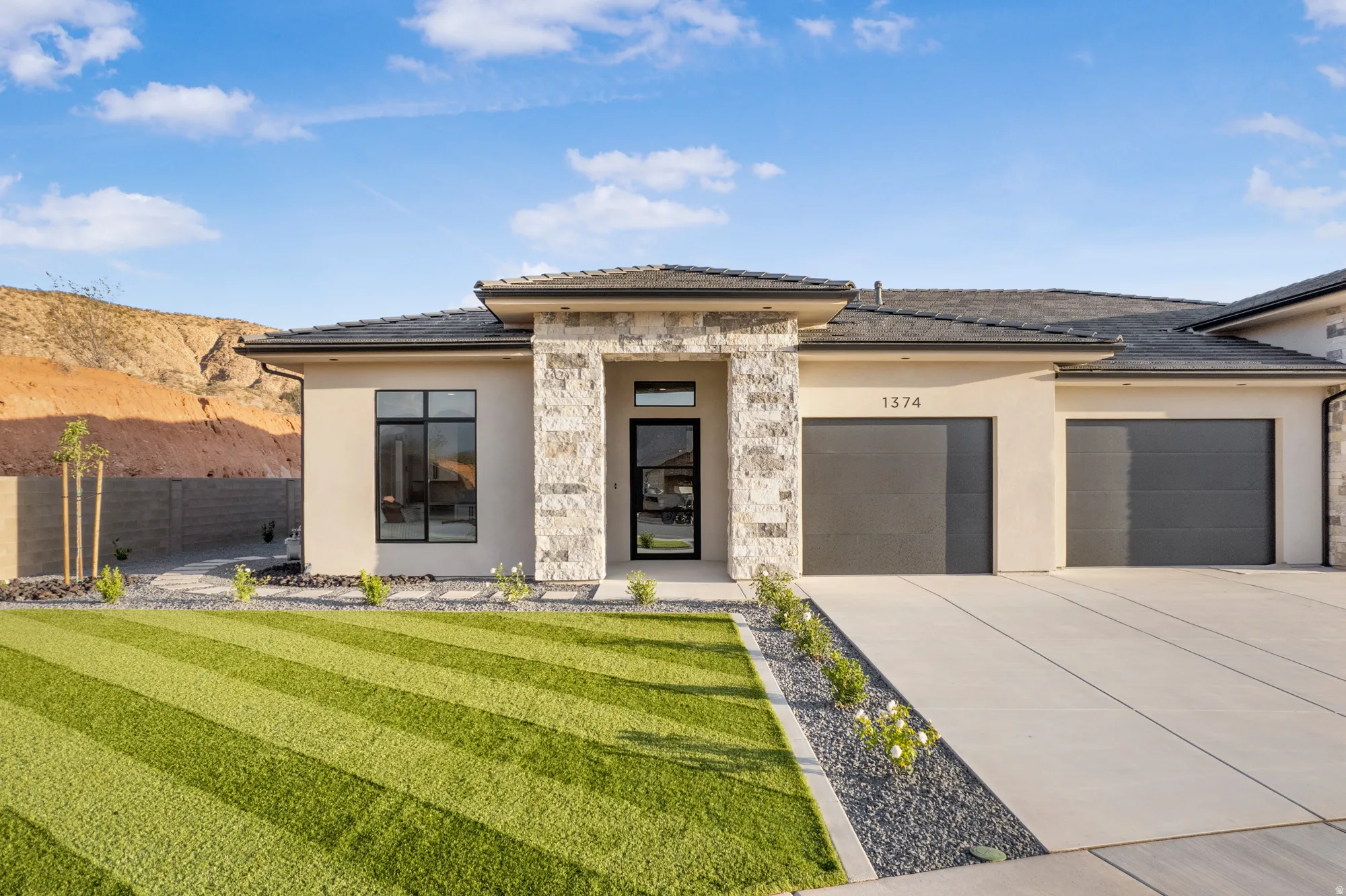 Contemporary single-story residence with stone and stucco exterior