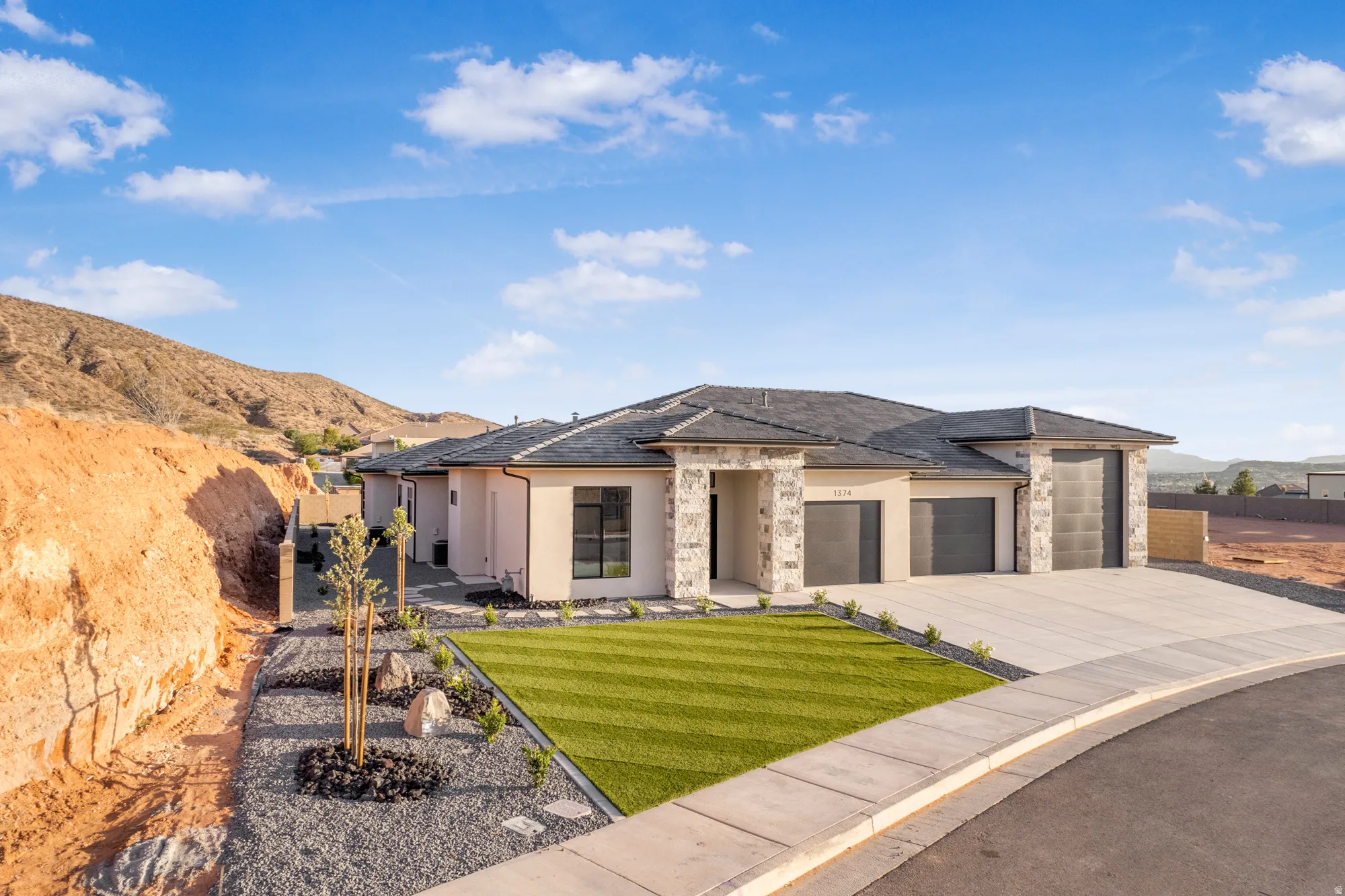 Contemporary stucco exterior with stone accents