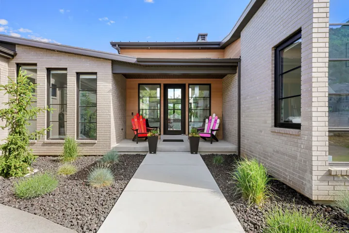 Modern exterior with light brick and wood-clad accents
