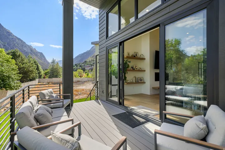 Expansive outdoor deck featuring composite decking and black horizontal railings