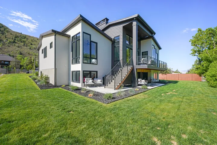 Contemporary exterior featuring a multi-level design with stucco and siding finishes