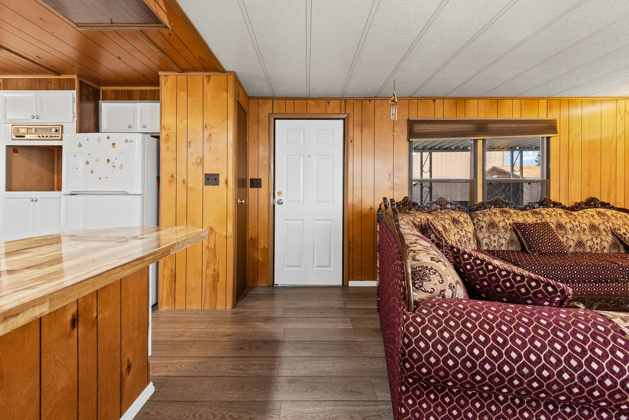 Interior space featuring wood-finish flooring and extensive wood paneling