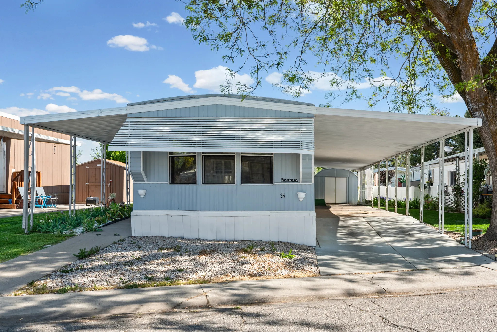 Light blue siding exterior featuring multiple windows with horizontal blinds