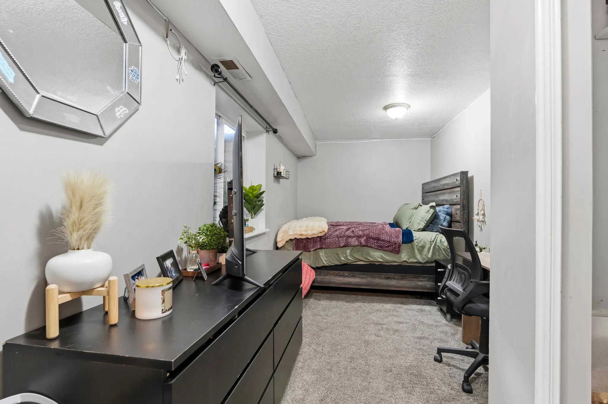Carpeted room featuring a light gray color palette