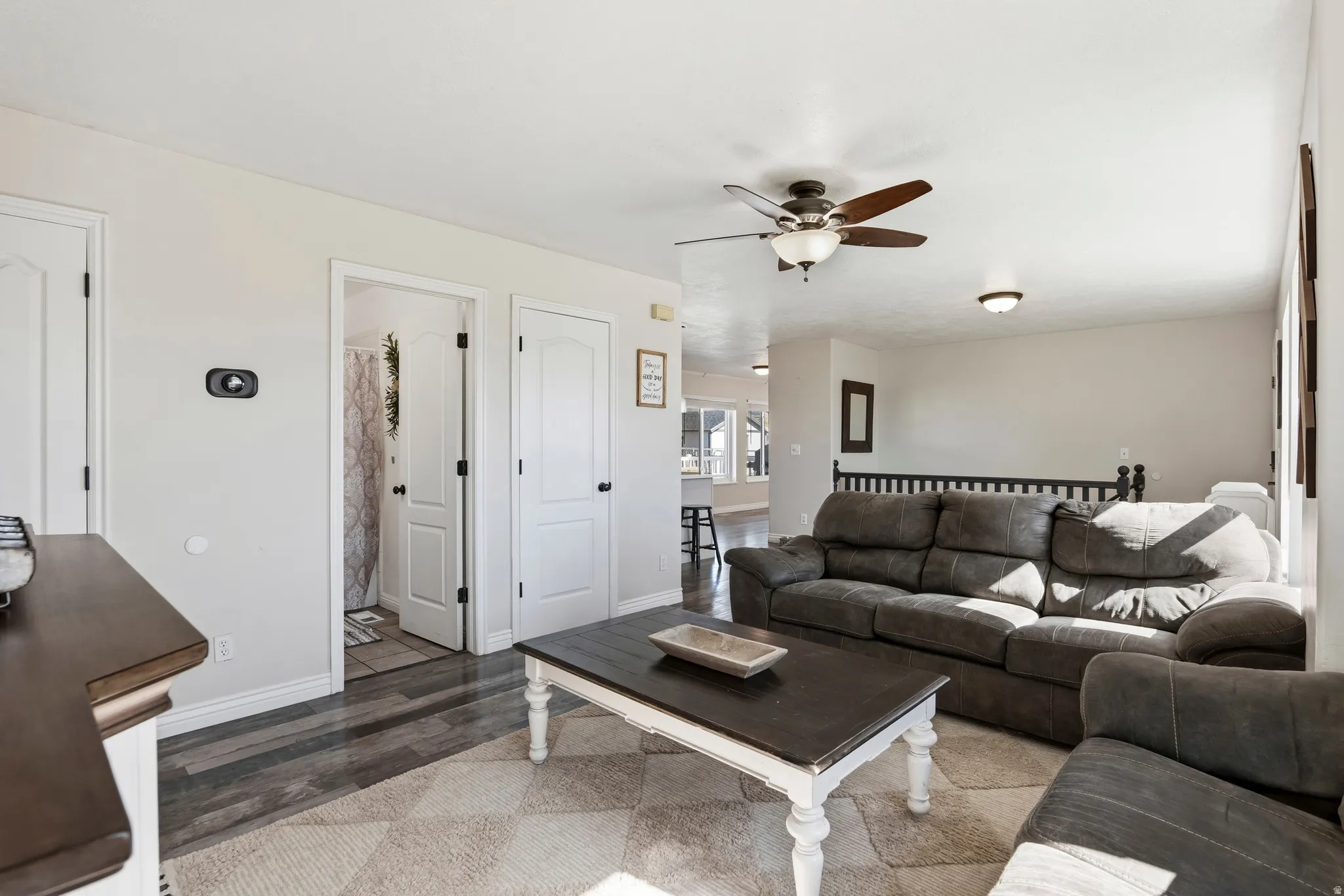 Light-toned walls complement wood-finish flooring in this living space