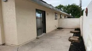 Private patio space featuring concrete paving
