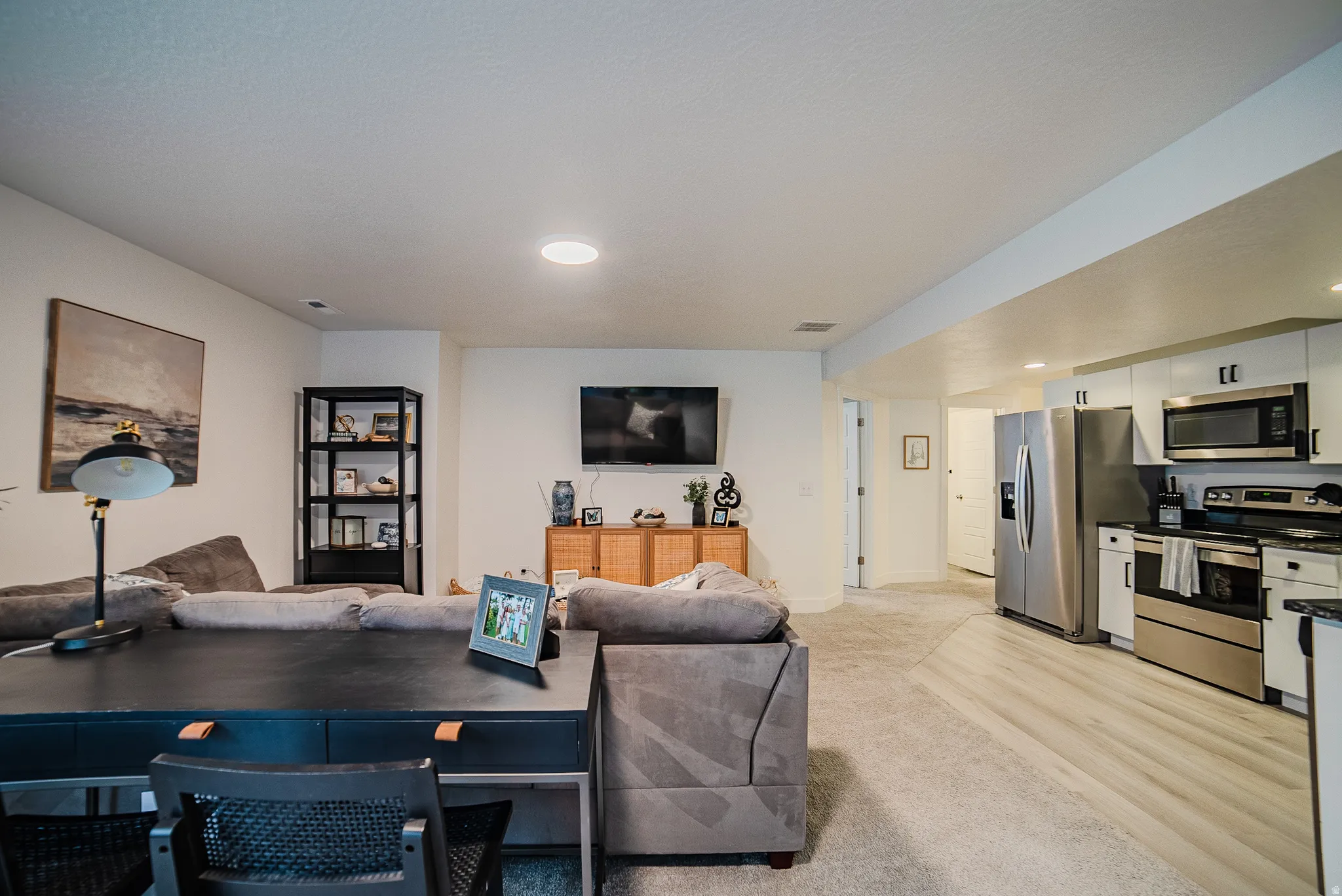 Open-concept living area featuring recessed lighting and light-toned walls