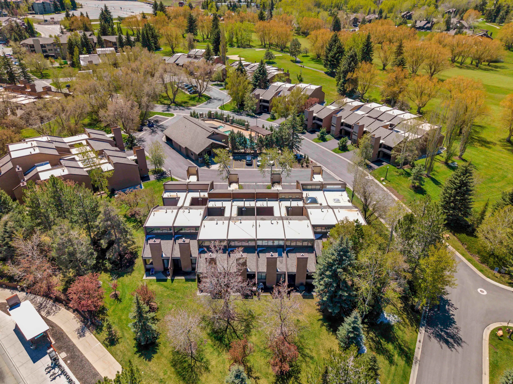 Aerial perspective of community facing South. Unit is across from the pool and clubhouse