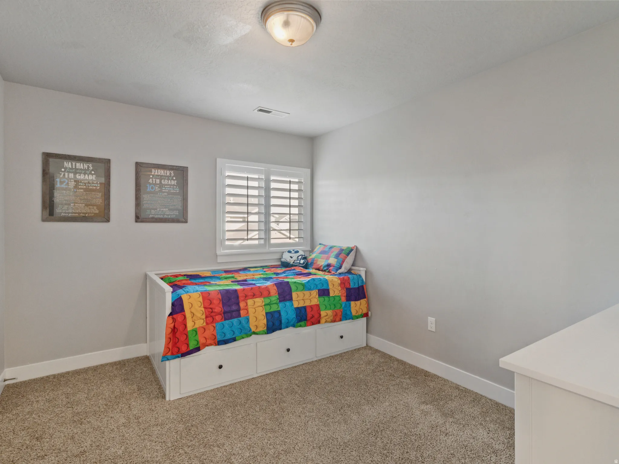Room featuring neutral wall tones and plush carpeting
