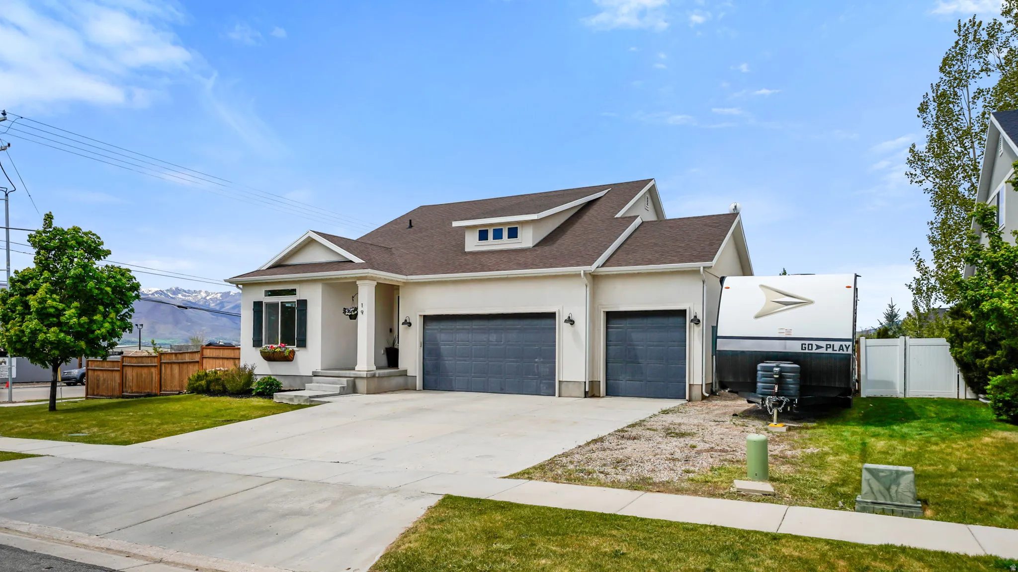 Contemporary 2-story residence with a light-colored stucco exterior