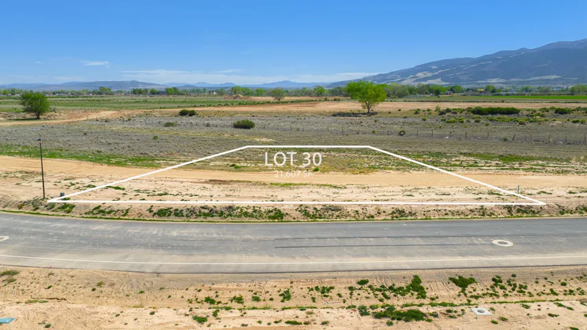 Expansive Lot 30 spanning 21,607 square feet, featuring direct road frontage