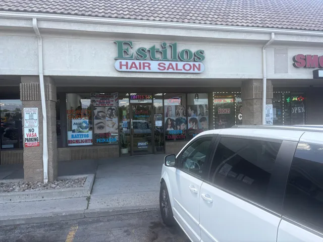 Commercial storefront with large display windows, recessed entry, and exterior signage