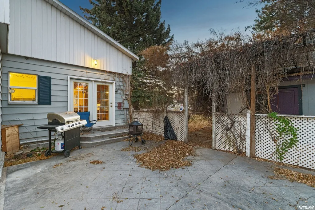 View of patio with area for grilling and french doors