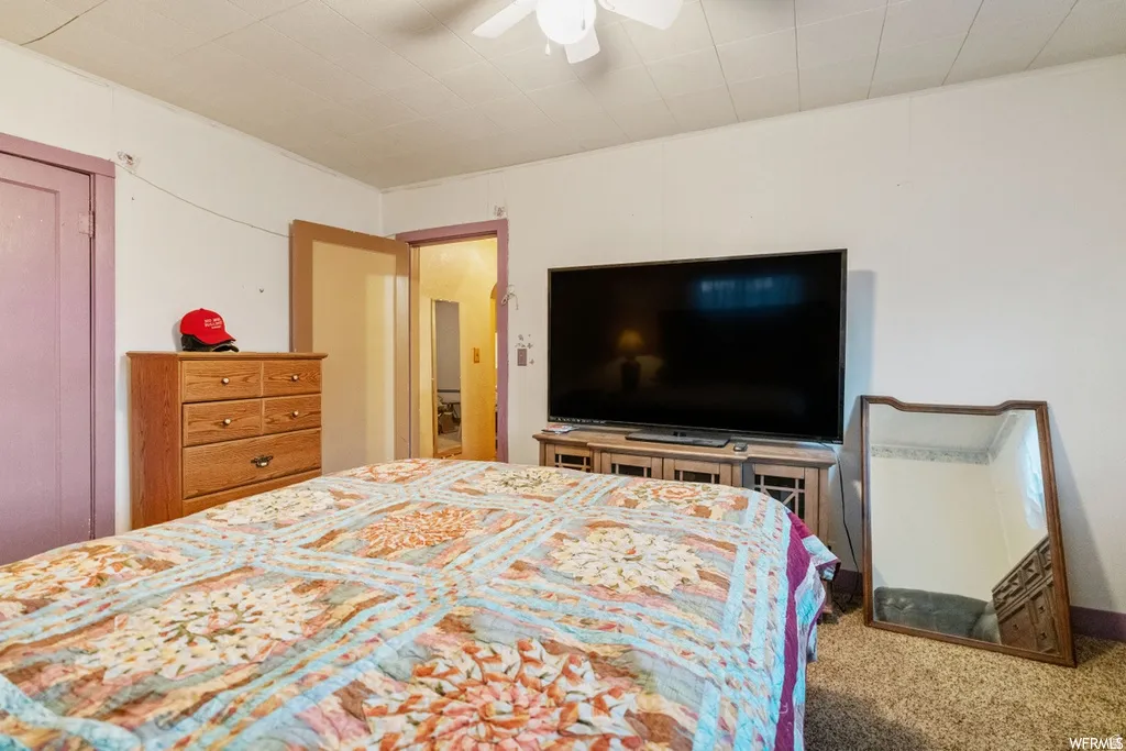 Bedroom with carpet flooring and ceiling fan