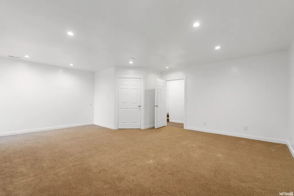 Basement featuring recessed lighting and carpet flooring