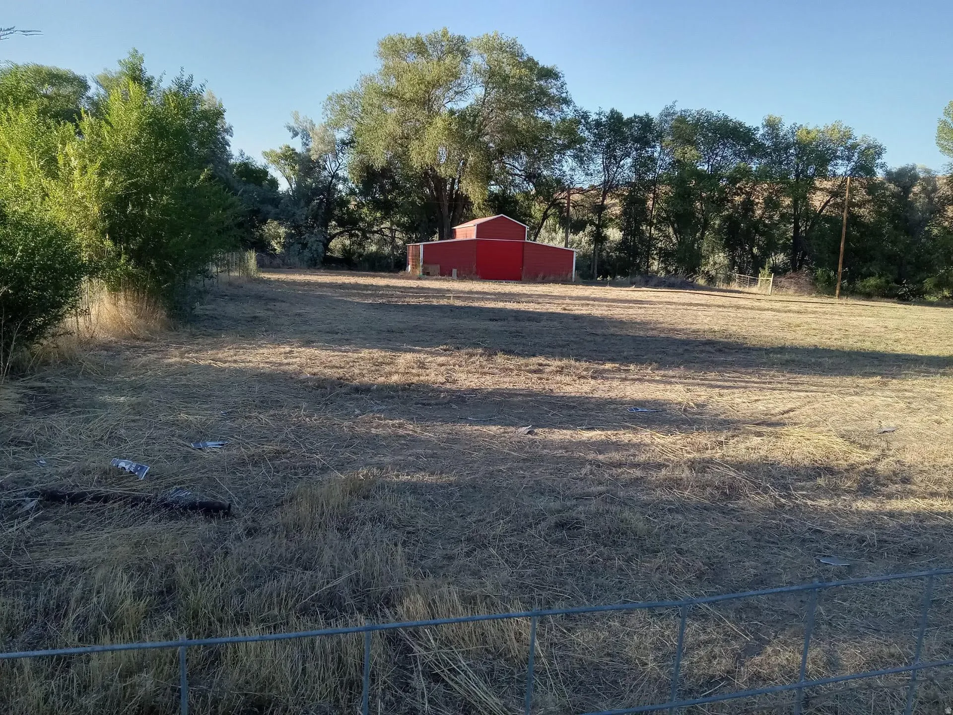 View of yard featuring an outbuilding and a view of rural / pastoral area