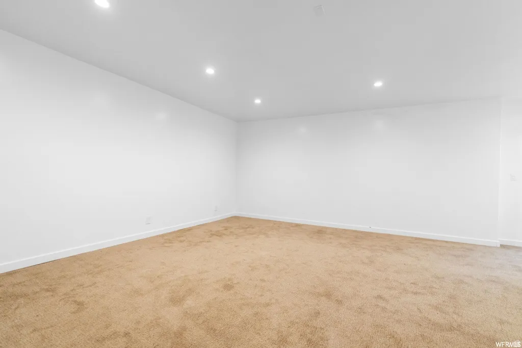 Unfurnished room with carpet flooring and recessed lighting