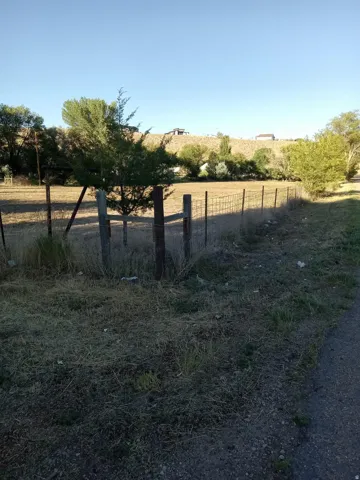 View of yard with a rural view
