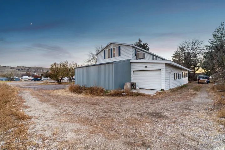 View of garage at dusk