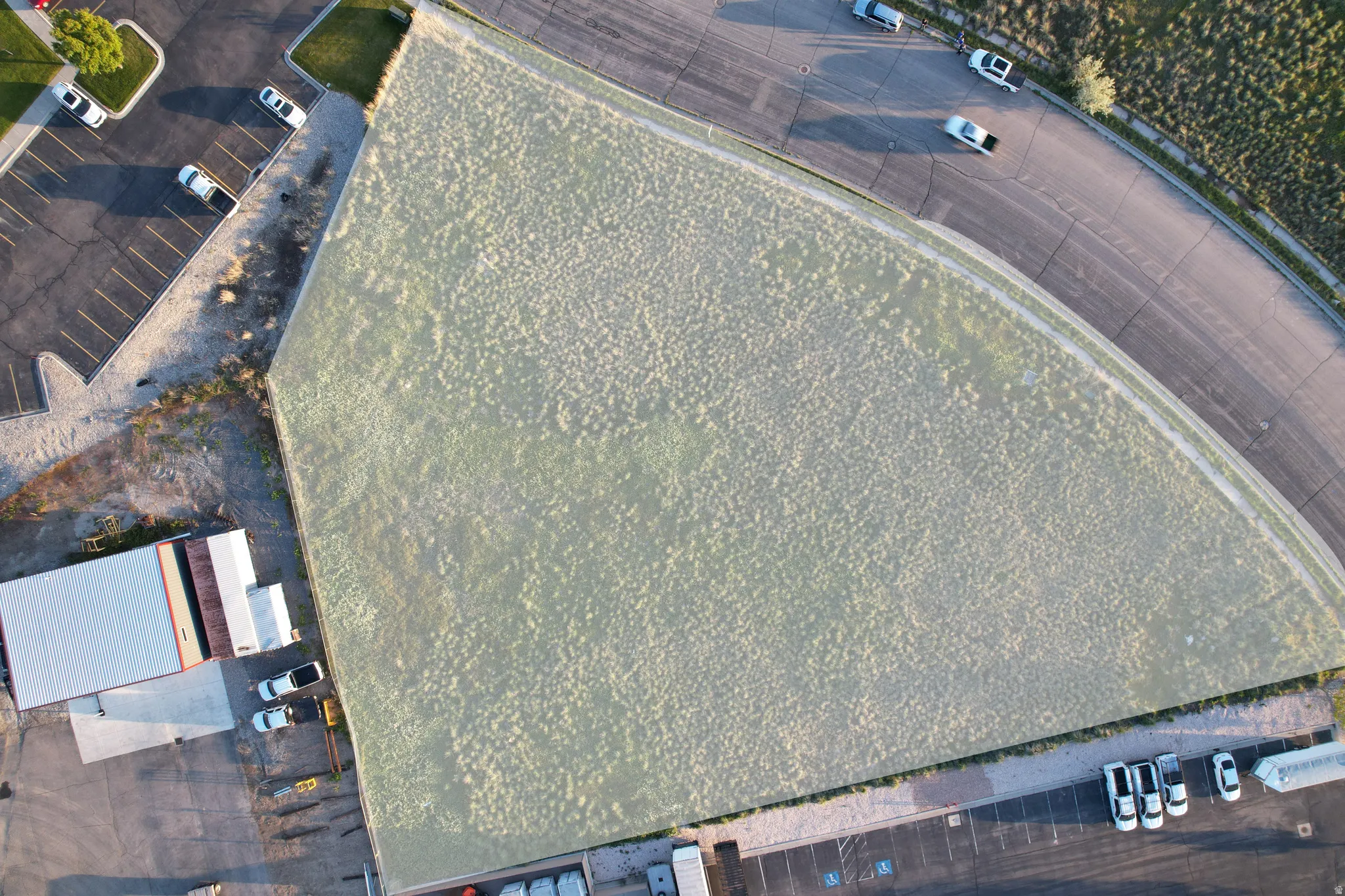 Highlighted aerial view of the 1.38-acre commercial land lease parcel with surrounding access, nearby businesses, and development momentum.
