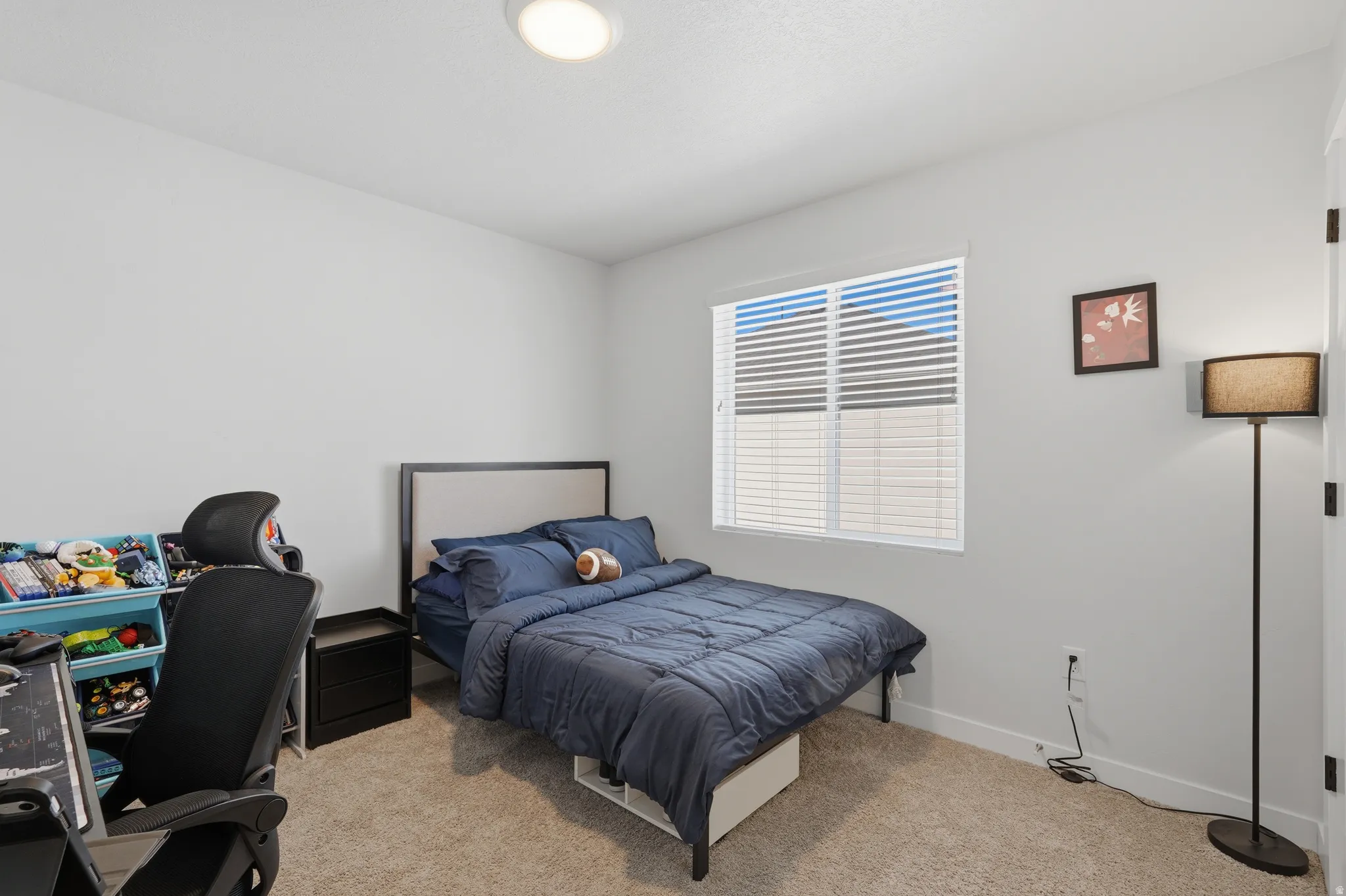 Bedroom featuring a window with white blinds, neutral wall paint, recessed lighting, and carpeted flooring