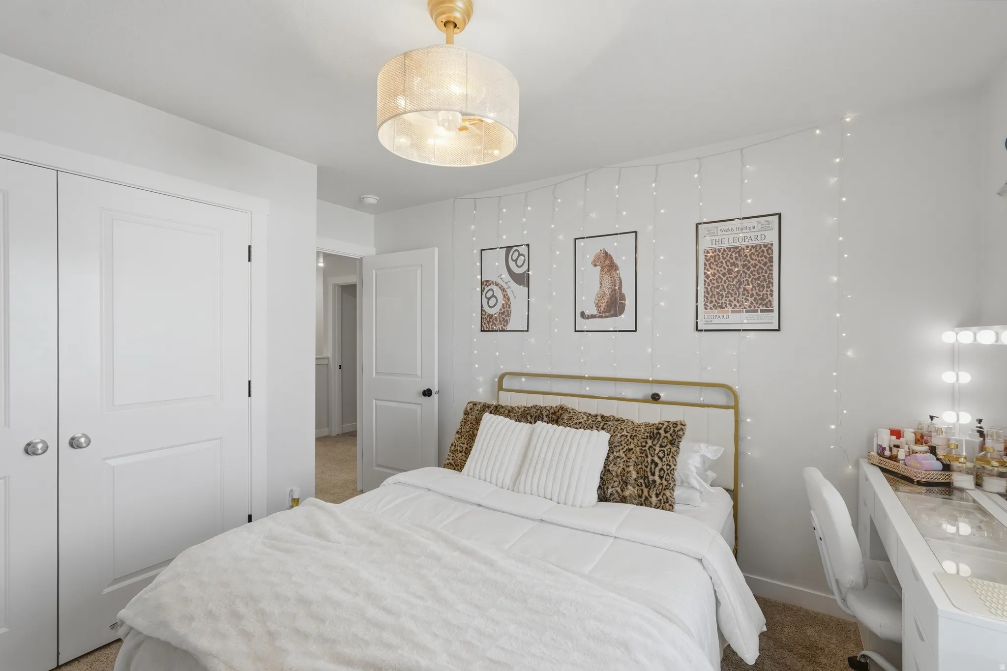Bedroom featuring a drum pendant light fixture, white walls, and carpet flooring