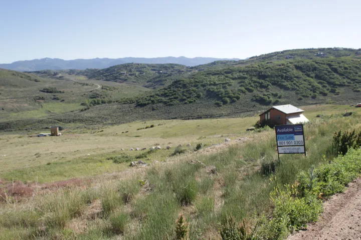 Expansive rolling hills landscape with distant mountains