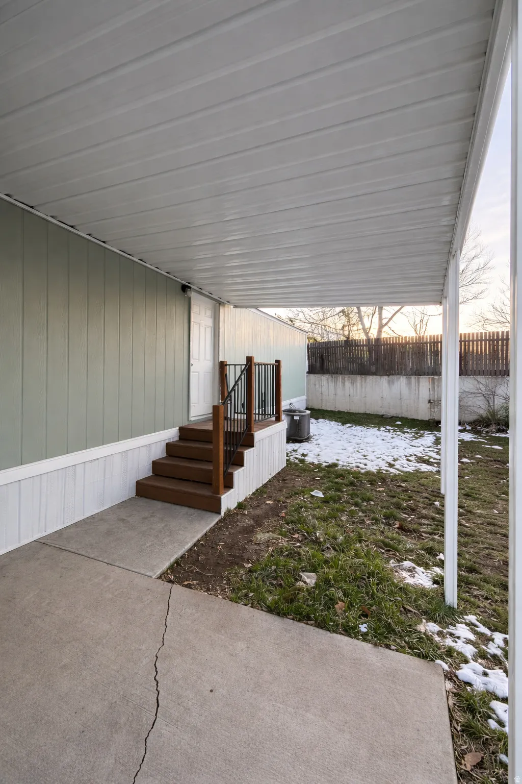 Covered concrete patio with direct entry access