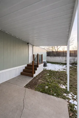 Covered concrete patio with direct entry access